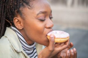 person Eats Donut 1453210475 770x533 1 650x428