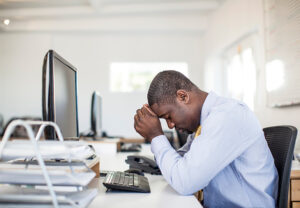 man stressed at work