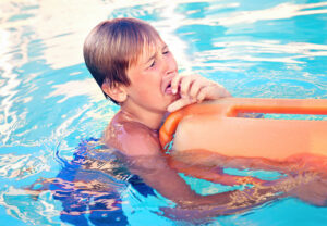 child Swimmer Coughing in Water 694944066 770x533 1