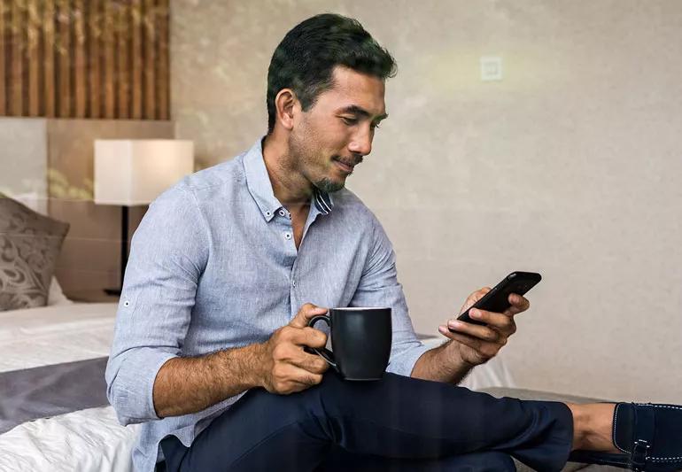 man looking at smartphone 1402170982 770x533 1 jpg